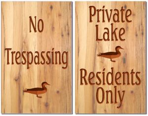 NO Trespassing and Private Lake signs
